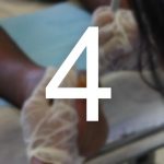 A person treats a person's foot. They have had a partial amputation. The number 4 sits over the photo.